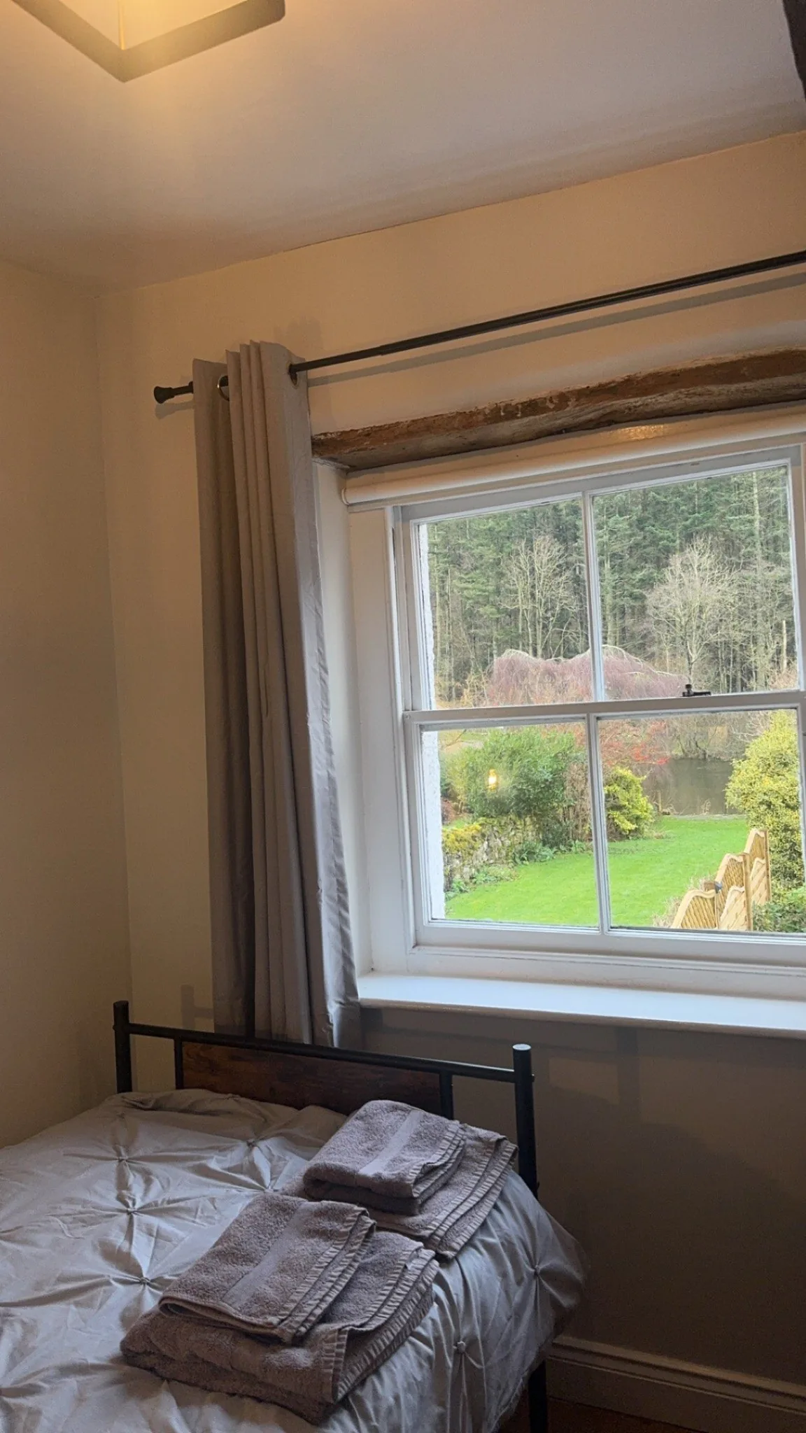 View from the riverside bedroom over the garden