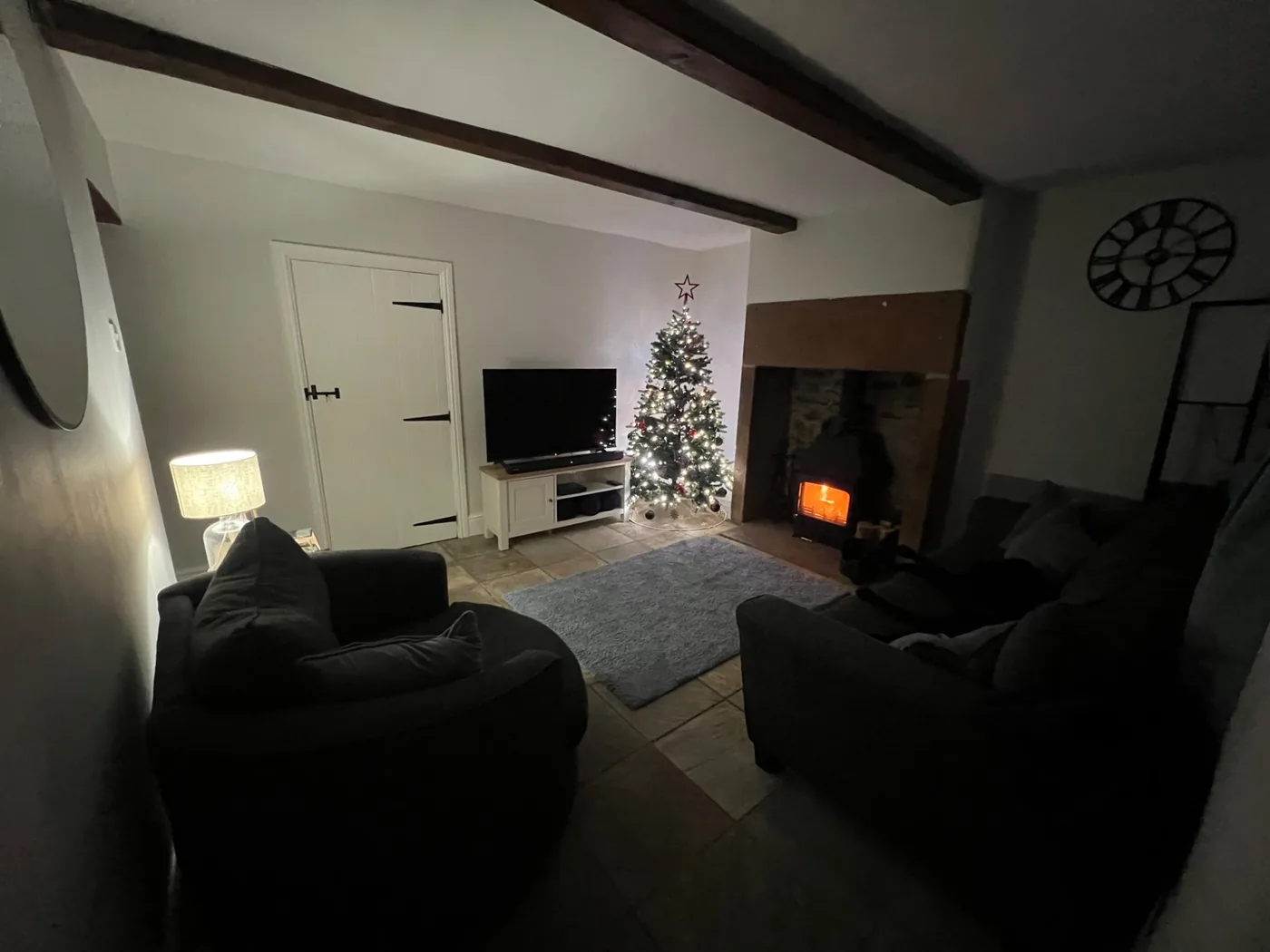 The living room with the wood-burning stove lit